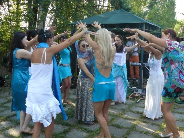 Participants dancing together outdoors