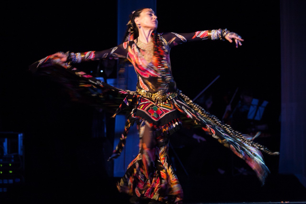 MOHSIRA performing a dynamic dance on stage